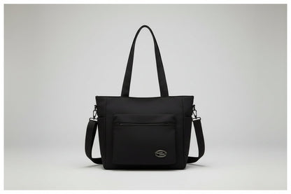 Black bag on a denim jacket with a white background
